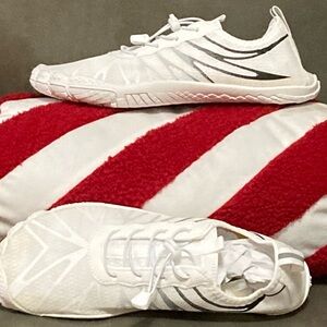 Woman’s Barefoot White and Black Athletic Shoes